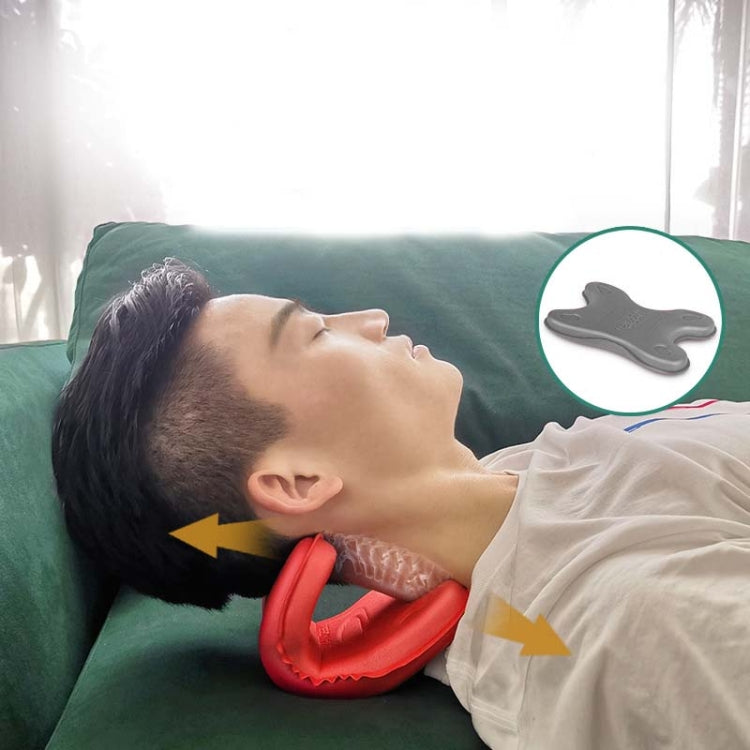 Red neck pillow massager under the head on a bed for cervical support