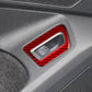 Red carbon-fiber trunk switch sticker with cutout on car panel