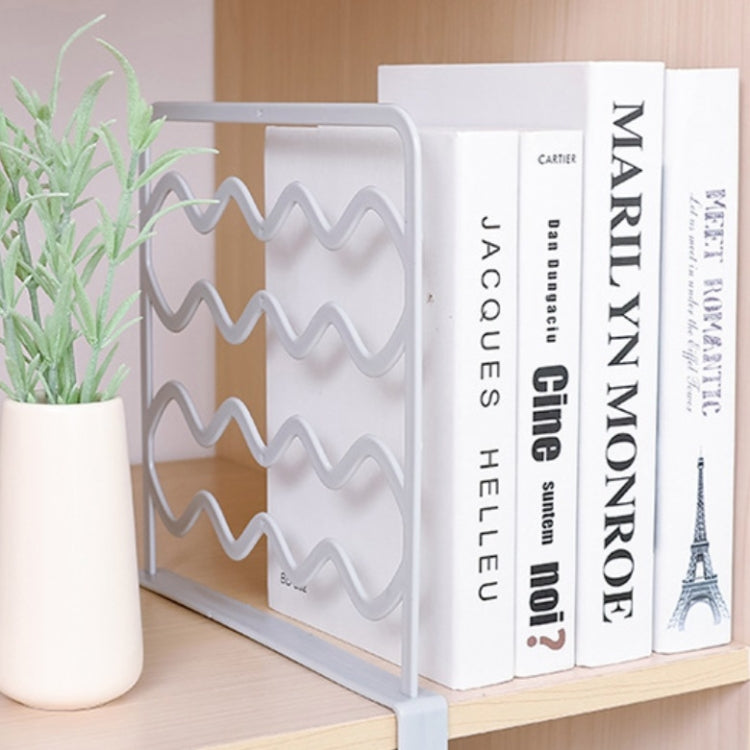 White wavy shelf divider bar holding upright books and papers on a shelf