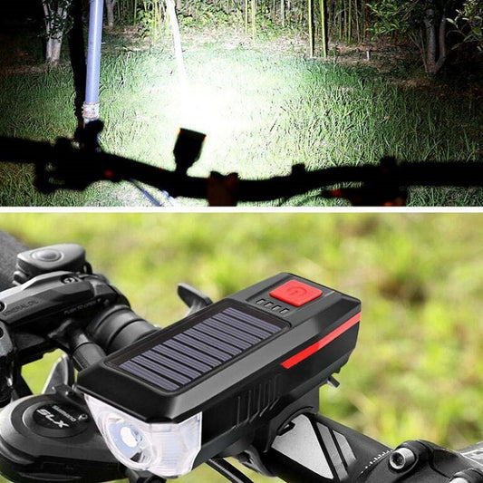 Red bicycle solar headlight with white beam on handlebar and horn button