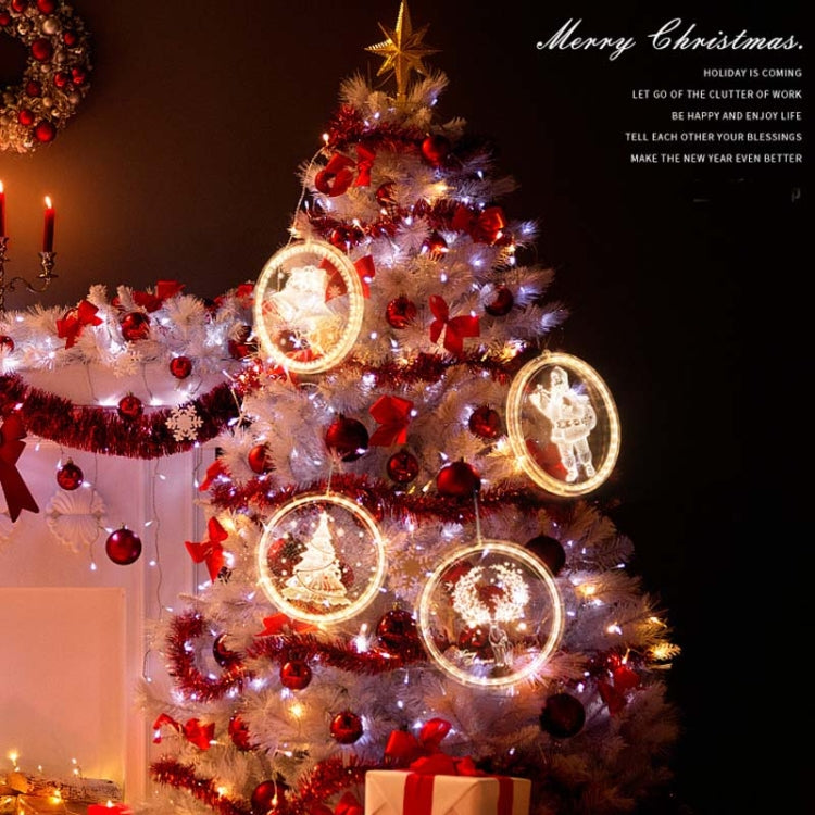 Christmas tree decorated with hanging round LED lights and illuminated circles