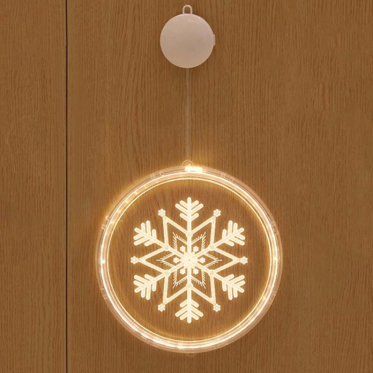 Hanging round LED Christmas light with snowflake icon and warm glow