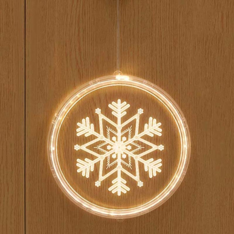 Hanging LED light decoration with large glowing snowflake pattern