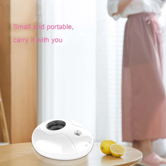 White mini ultrasonic humidifier with round top opening for water bottle reservoir