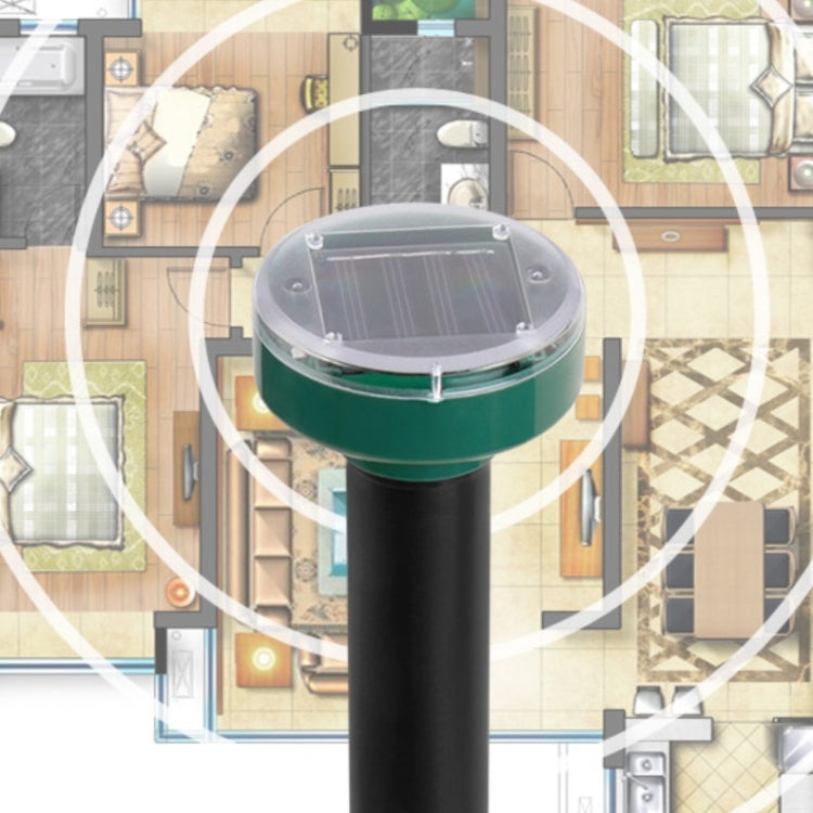 Solar mouse repeller stake with glowing ring effect over a layout background