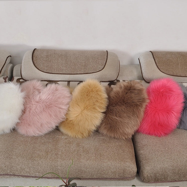 Heart-shaped faux fur cushion pillow set on sofa in assorted colors