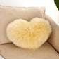 Yellow heart-shaped faux fur pillow cover with soft fluffy texture