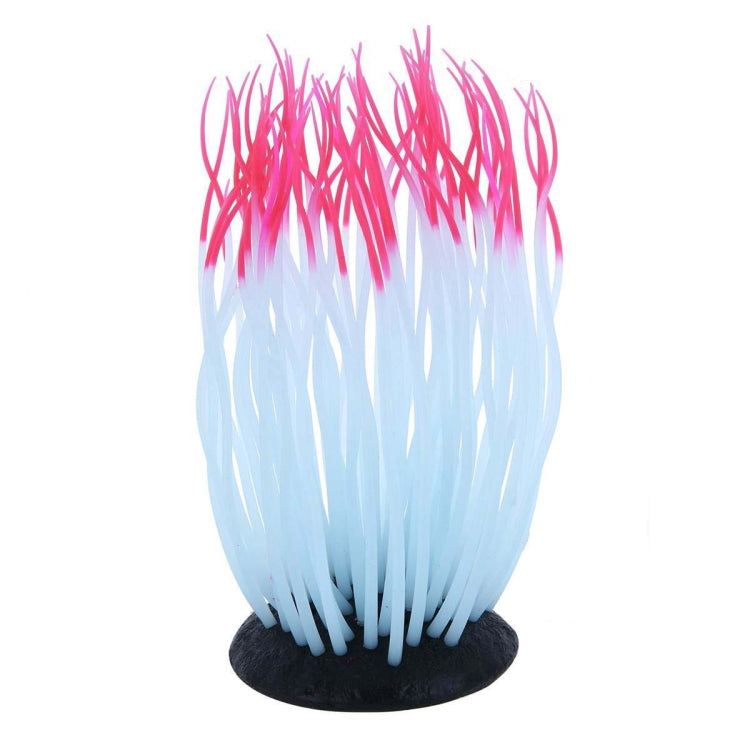 Coral tree aquarium ornament with bright pink top and white-to-light blue strands, black base