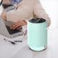 Turquoise car humidifier night light diffuser with mist output, plugged in