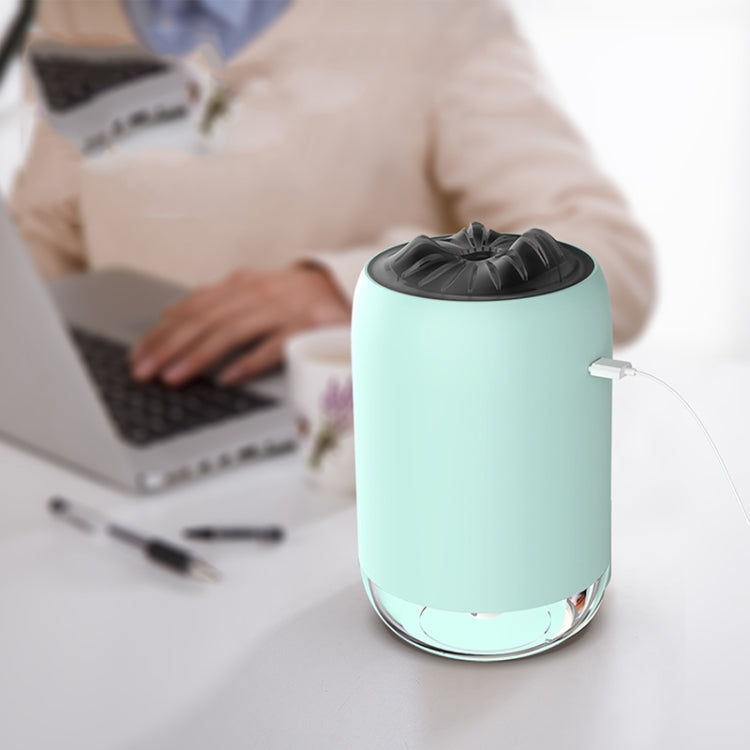 Turquoise car humidifier night light diffuser with mist output, plugged in