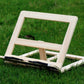 Wooden reading rack stand with black feet and light natural wood frame