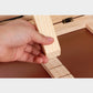 Wooden reading rack stand with adjustable angle and metal clip hardware, light wood