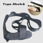 Black leg stretching belt with foot loop and adjustable straps, flat lay.