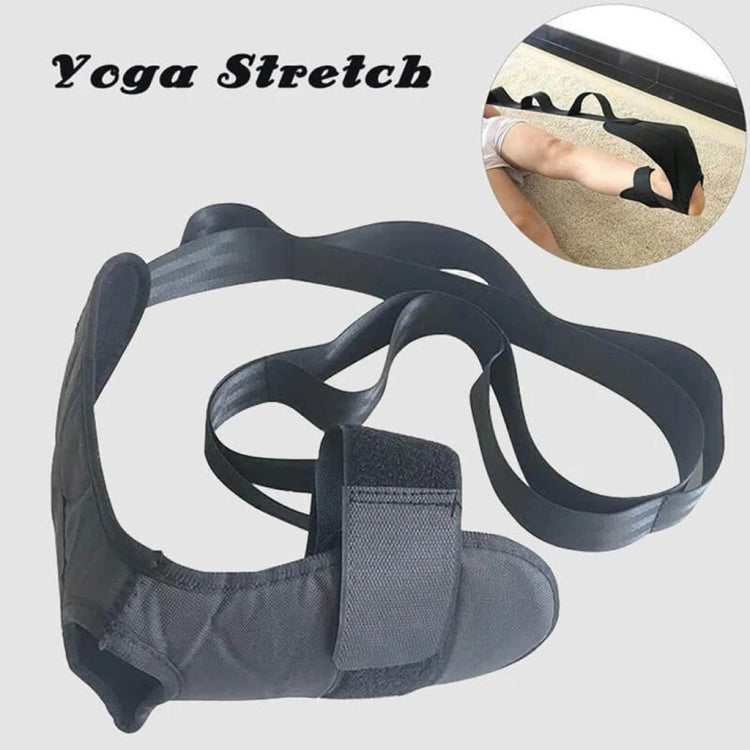 Black leg stretching belt with foot loop and adjustable straps, flat lay.
