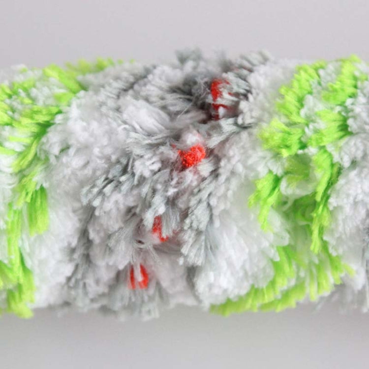 Close-up of gray vacuum brush roller with neon green fibers and red bristle tips