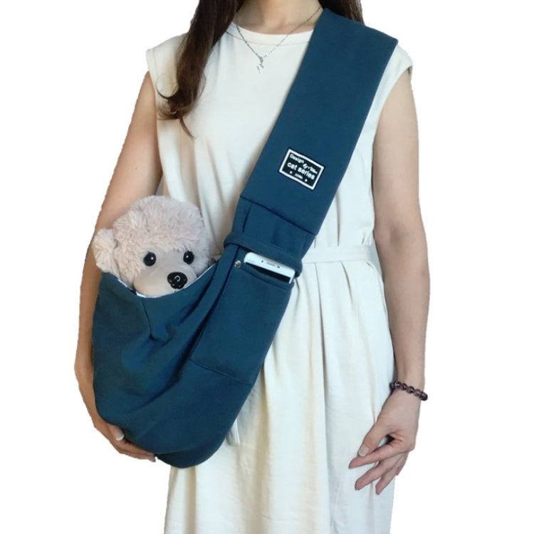 Cotton pet messenger shoulder bag in dark blue with front pocket, carrying plush dog