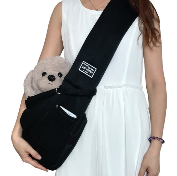 Cotton pet messenger shoulder bag in black with front pocket, carrying plush dog