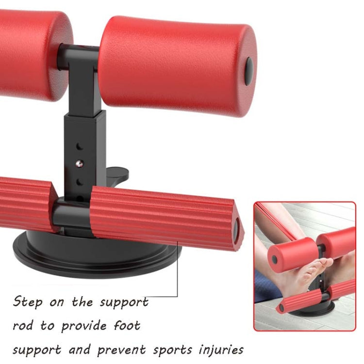 Red abdominal curler sit-up aid with black post, foam supports, and suction base.
