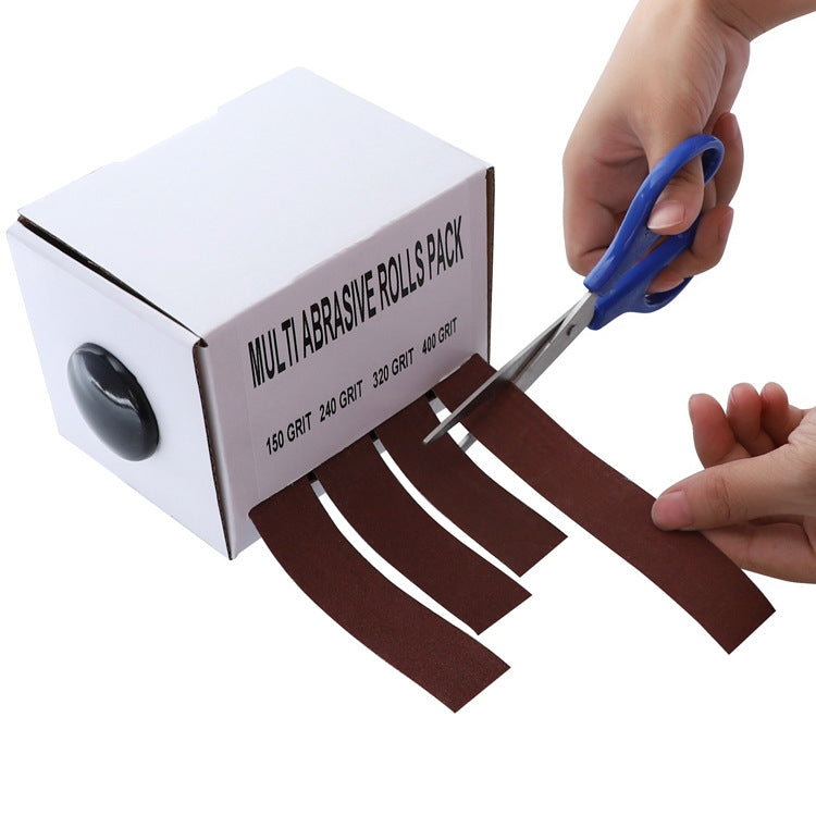 Hand cutting brown emery sanding strip from multi-abrasive roll pack