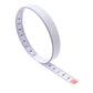 Self-adhesive steel tape measure in curve with metric scale markings on strip