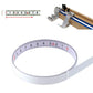 Self-adhesive steel tape measure loop with metric scale markings in a curved band