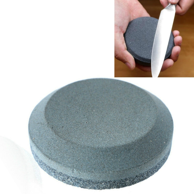 Round dark gray whetstone knife sharpener, flat grinding surface, handheld size