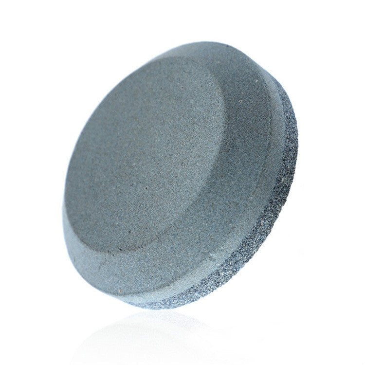 Round dark gray whetstone knife sharpener, slanted side view