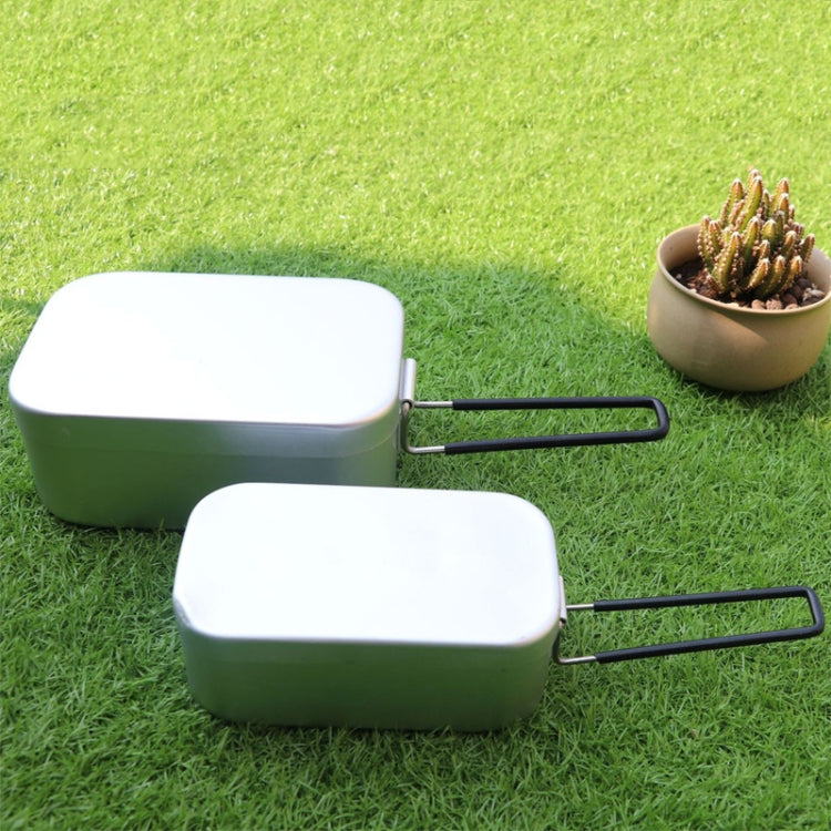 Two-piece portable lunch box set with green body, white lids, and black handles
