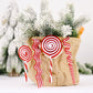 Red and white candy swirl Christmas ornaments in a burlap pouch