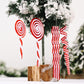 Hanging red and white candy spiral Christmas ornaments, including wavy stick