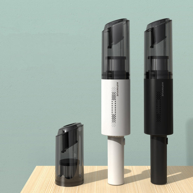 Handheld vacuum cleaners in black and white with compact charging base