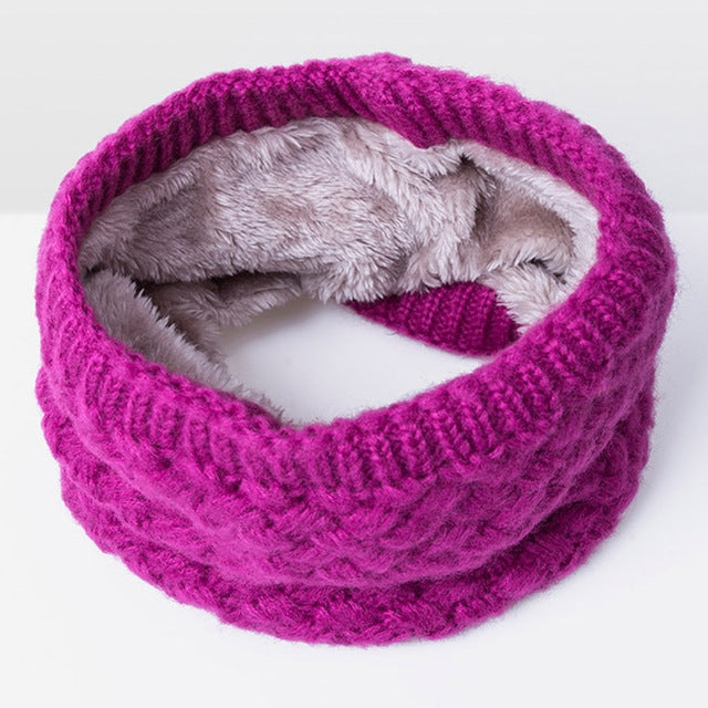 Hot pink knit infinity scarf with thick ribbed texture and soft gray fleece lining