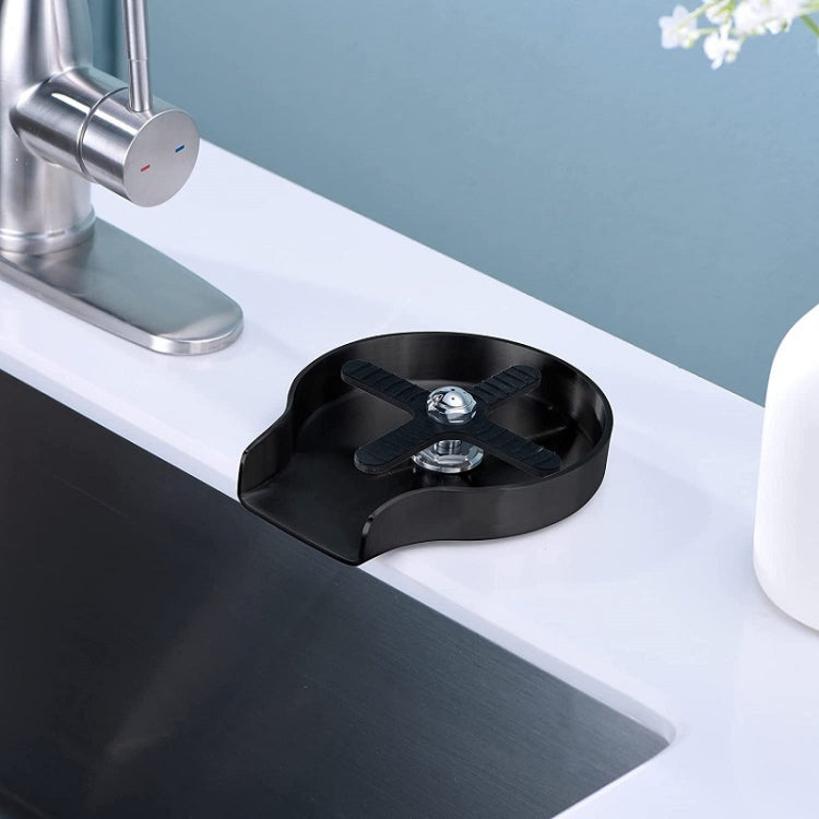 Black embedded cup washer insert with rotating nozzle on countertop