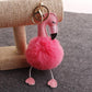 Flamingo plush keychain with bright pink pom pom and pink-and-black beak, metal ring