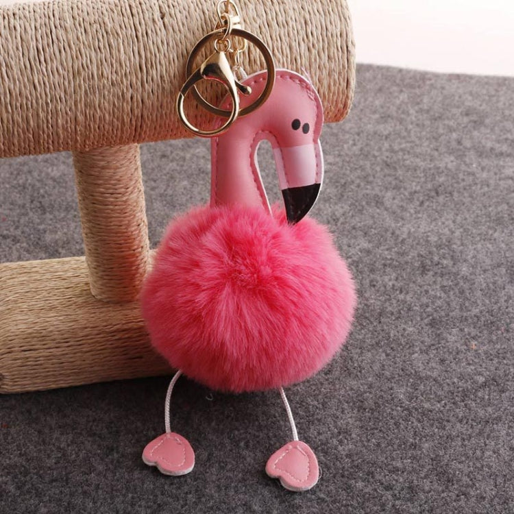 Flamingo plush keychain with bright pink pom pom and pink-and-black beak, metal ring