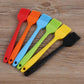 Assorted silicone oil basting brushes in red, orange, blue, green, yellow, and black colors.