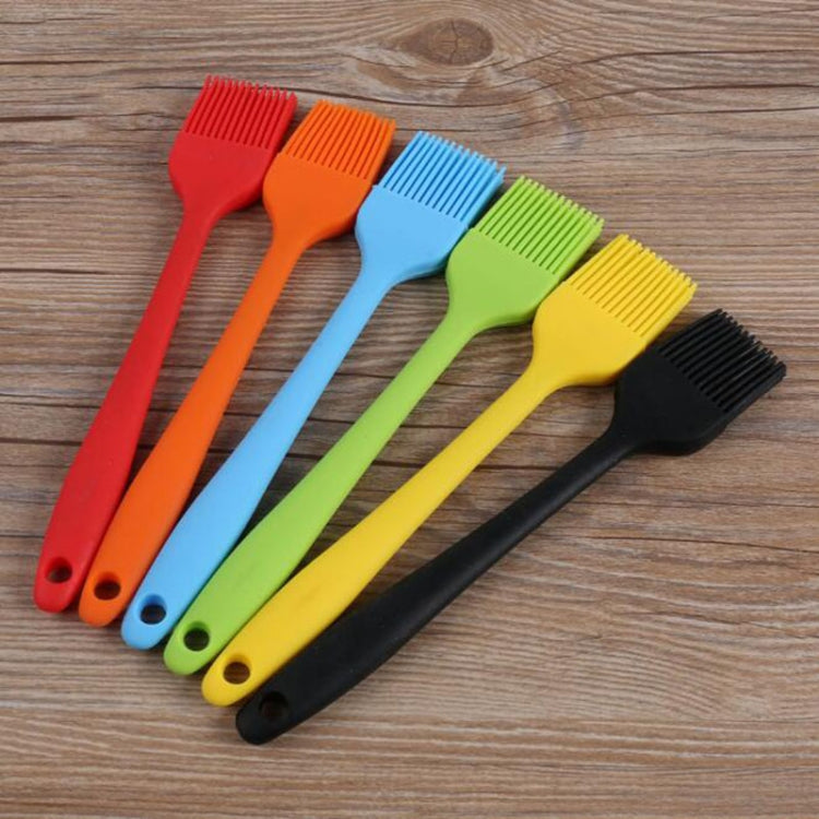Assorted silicone oil basting brushes in red, orange, blue, green, yellow, and black colors.