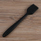 Black silicone oil basting brush with fan bristle head and hanging hole handle.