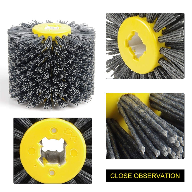 Abrasive wire drawing wheel with yellow center hub and gray wire brush bristles