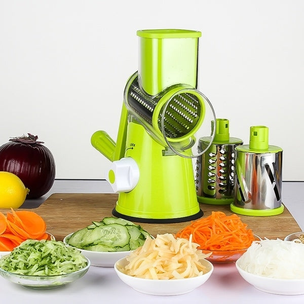 Green electric fruit and vegetable slicer with stainless drum and bowl attachments