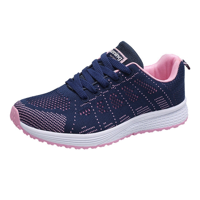 Women's navy mesh lace-up running sneakers with pink lining and white sole