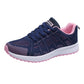 Women's navy mesh lace-up running sneakers with pink collar and white sole