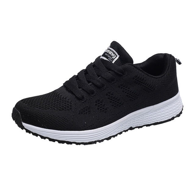 Black mesh knit lace-up flat running sneaker with white rubber sole