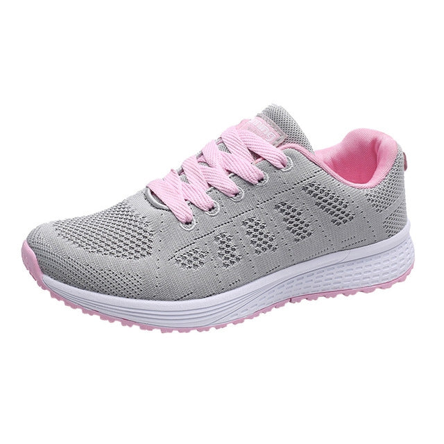 Gray knit lace-up running sneaker with pink accents and white rubber sole