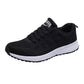 Black mesh lace-up running sneaker with white rubber sole and textured outsole