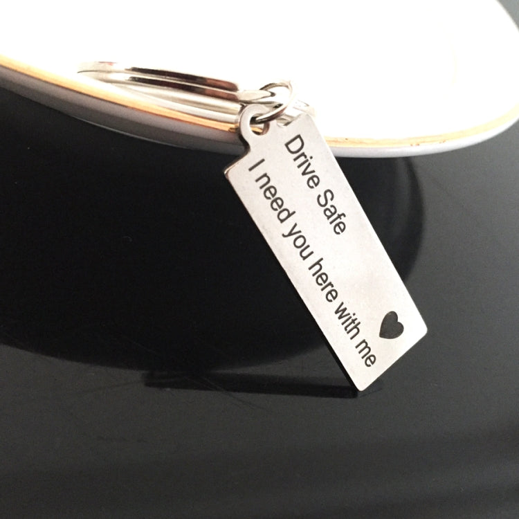 Silver keychain keyring with engraved tag text “Drive Safe I need you here with me”