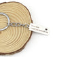 Silver keyring with chain and engraved rectangular tag, “Drive Safe I need you here with me”
