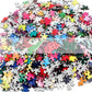 Round jigsaw puzzle pieces scattered, multicolored puzzle mix