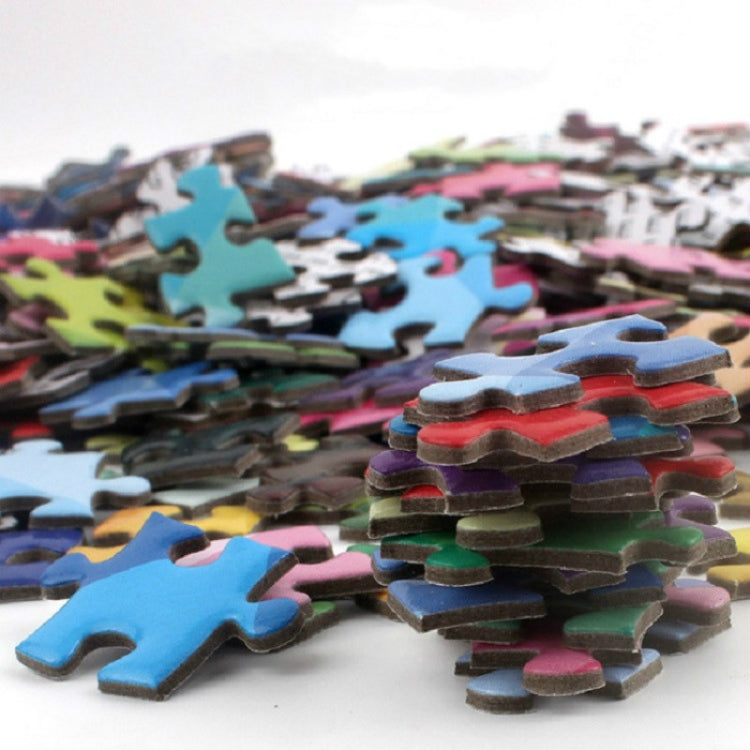 Colorful round jigsaw puzzle pieces stacked and loose, varied shapes