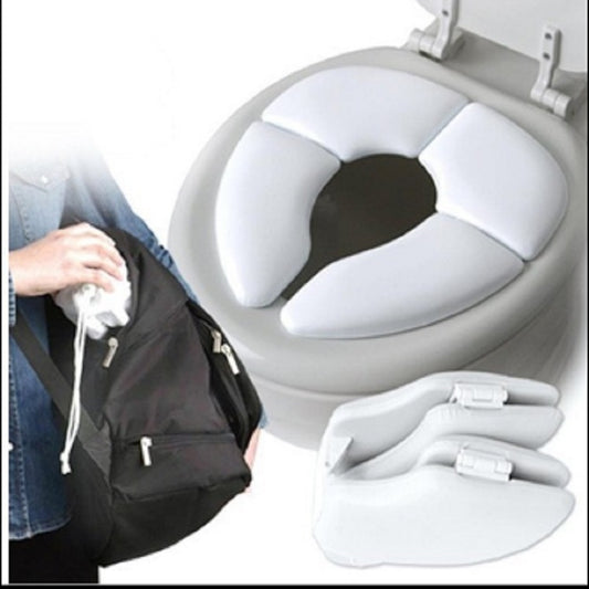 Padded white toilet seat cover for children, folding design with secure side tabs